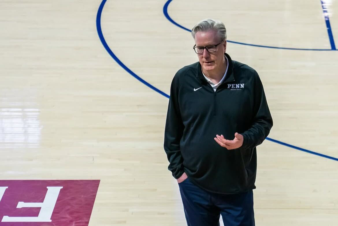 Coach Fran McAffery on a basketball court.