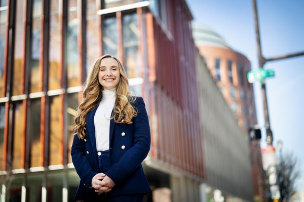 Lorea Peterson Redondo poses in front of the GSE and Wharton buildings.