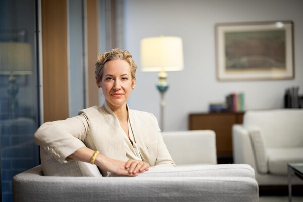 Brigitte Weinsteiger sitting on a sofa in her office