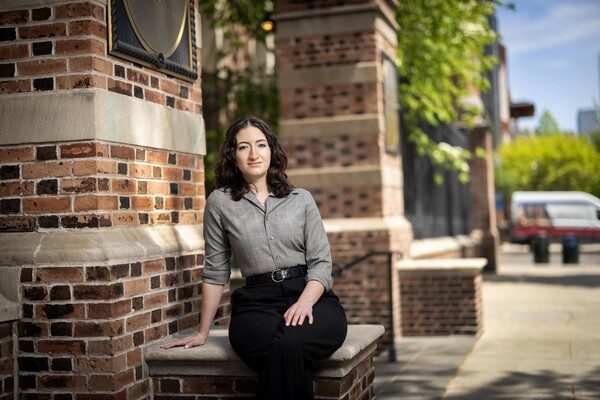 Christina Bartzokis sits outside Penn Carey Law.
